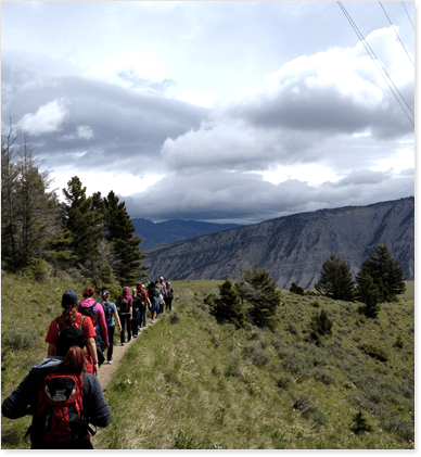 Girls hiking on a mountain from Eva Carlston Academy